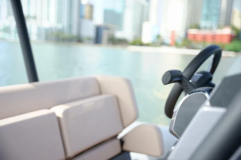 Slide: The Image of Interior view of 2026 Northstar Orion 8 boat with steering wheel and seating. - 19