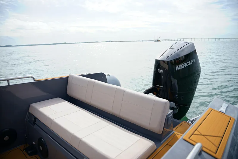 Slide: The Image of 2026 Northstar Orion 8 boat with Mercury engine on calm water. - 27