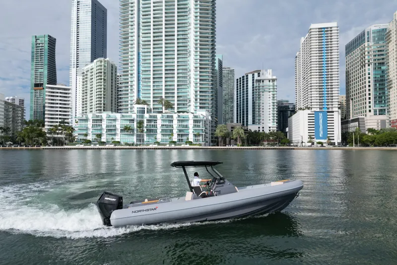 Slide: The Image of Northstar Orion 8 boat cruising near city skyline, 2026 model. - 5