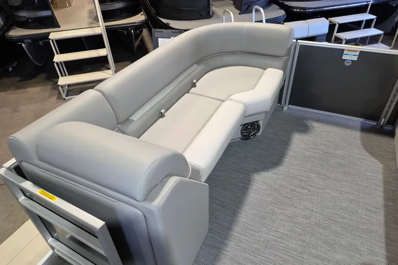 Slide: The Image of 2026 Godfrey Xperience 2286 SBX pontoon boat interior with gray seating and carpeted flooring. - 10