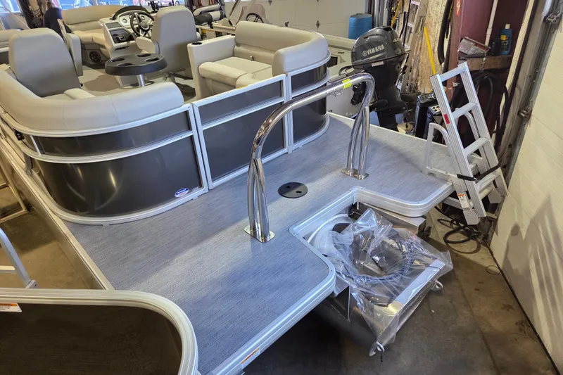 Slide: The Image of 2026 Godfrey Xperience 2286 SBX pontoon boat interior with seating and Yamaha motor. - 12