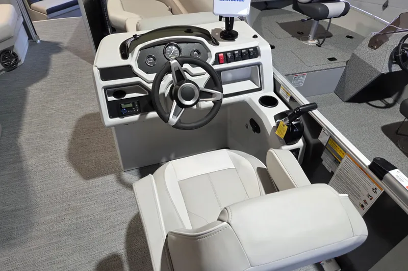 Slide: The Image of 2026 Godfrey Xperience 2286 SBX boat helm with steering wheel and controls. - 6