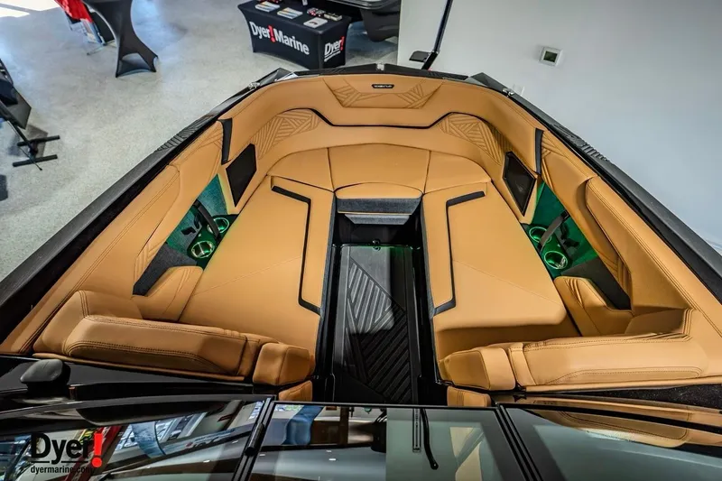 Slide: The Image of 2026 MasterCraft XStar 25 boat interior with tan leather seating and modern design. - 10