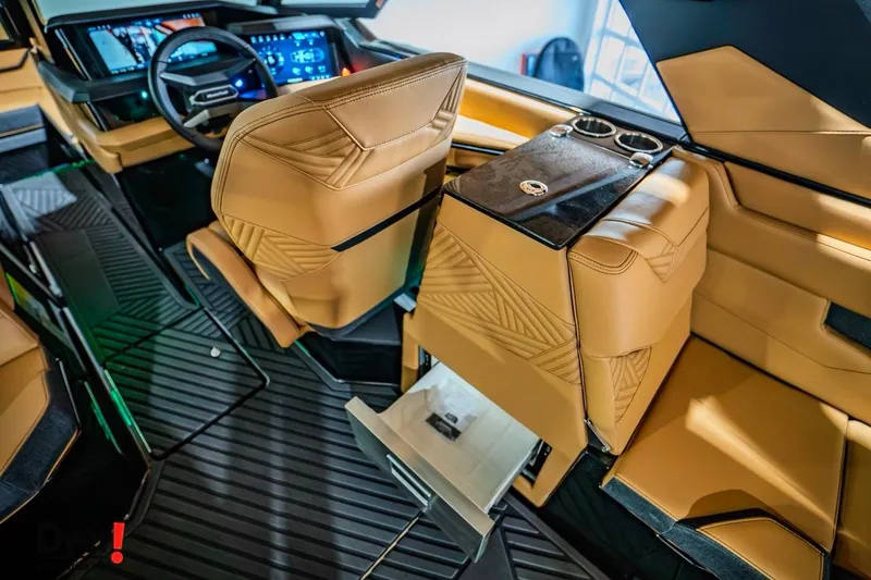 Slide: The Image of 2026 MasterCraft XStar 25 interior with luxurious tan seating and modern dashboard design. - 11