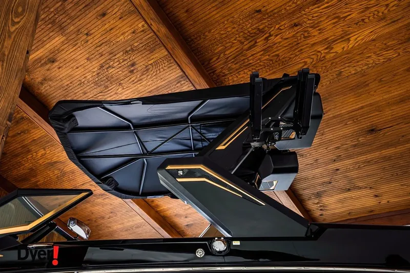 Slide: The Image of 2026 MasterCraft XStar 25 boat with sleek design under wooden ceiling. - 5