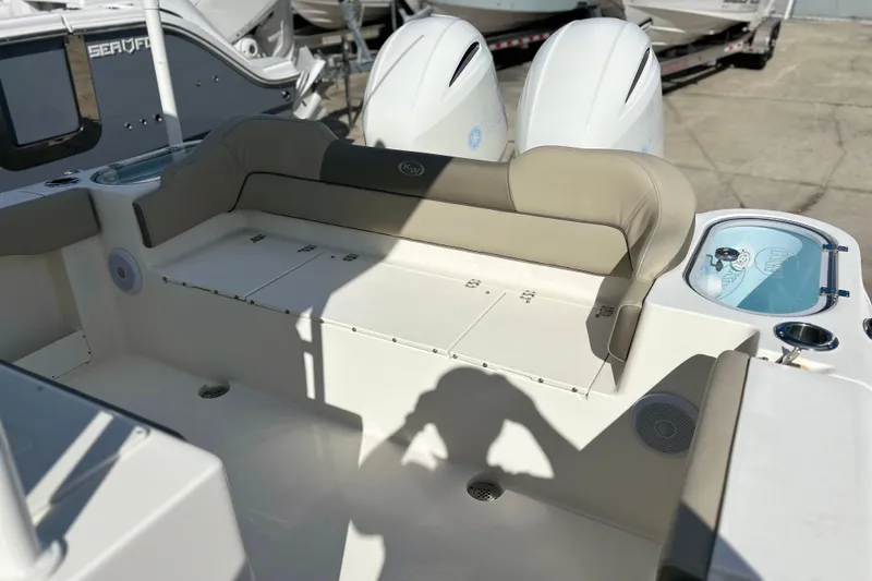 Slide: The Image of 2023 Key West 263 FS boat interior with seating and storage compartments. - 12