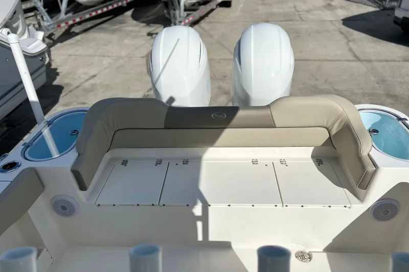 Slide: The Image of 2023 Key West 263 FS boat interior with dual engines and seating area. - 13