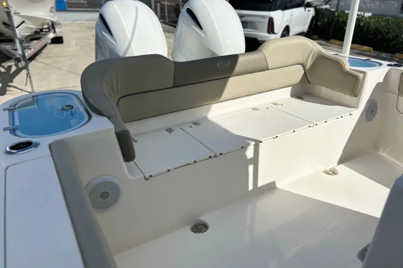 Slide: The Image of 2023 Key West 263 FS boat interior with cushioned seating and storage compartments. - 14