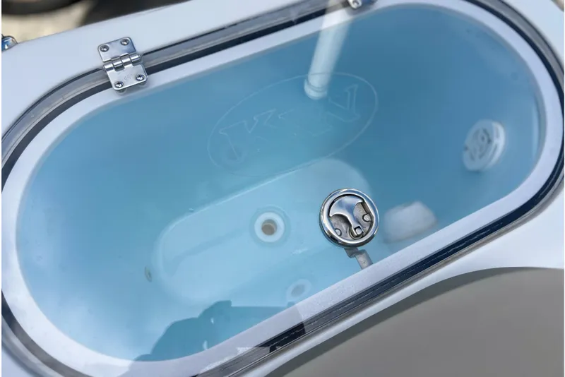 Slide: The Image of Livewell of 2023 Key West 263 FS boat, featuring a clear lid and stainless steel latch. - 18