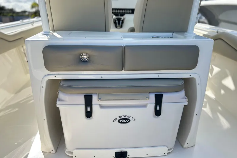 Slide: The Image of 2023 Key West 263 FS boat interior with storage compartment and cooler. - 19