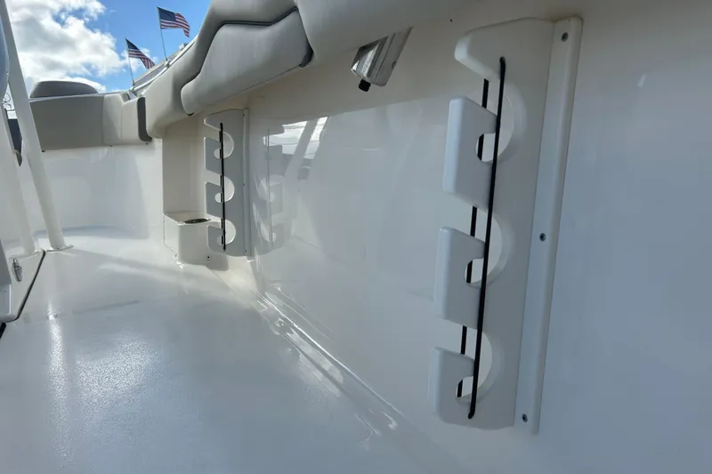 Slide: The Image of 2023 Key West 263 FS boat interior with rod holders and seating. - 24