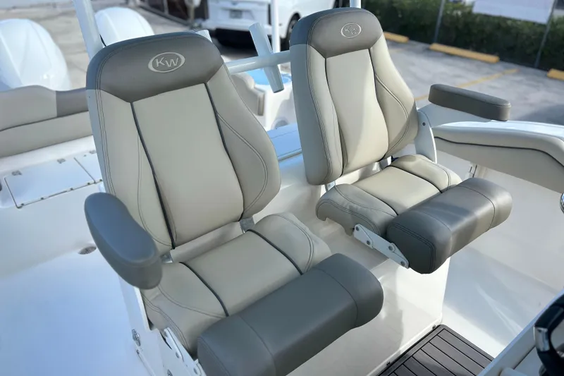 Slide: The Image of 2023 Key West 263 FS boat seats, featuring gray and beige cushioned design. - 28