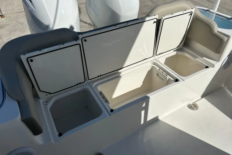Slide: The Image of 2023 Key West 263 FS boat storage compartments open, showcasing spacious interior design. - 33