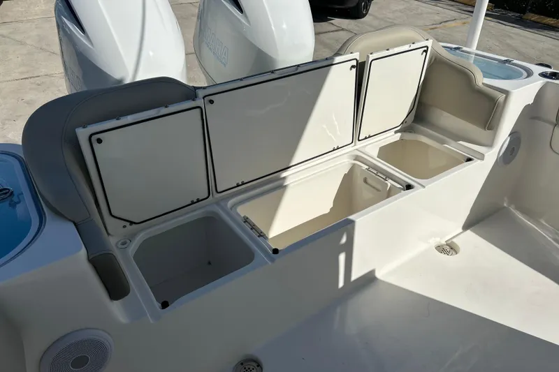 Slide: The Image of 2023 Key West 263 FS boat storage compartments and seating area. - 34