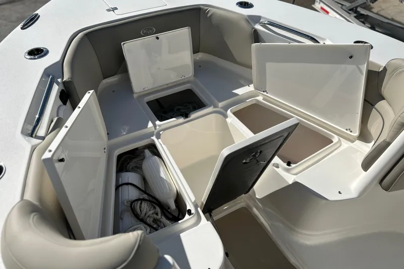 Slide: The Image of 2023 Key West 263 FS boat storage compartments open, showcasing ample space and organization. - 38