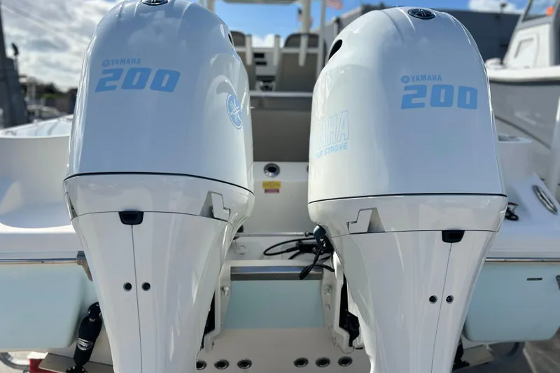 Slide: The Image of Twin Yamaha 200 engines on a 2023 Key West 263 FS boat. - 4