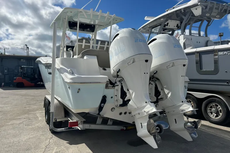 Slide: The Image of 2023 Key West 263 FS boat with dual Yamaha outboard motors on a trailer. - 42