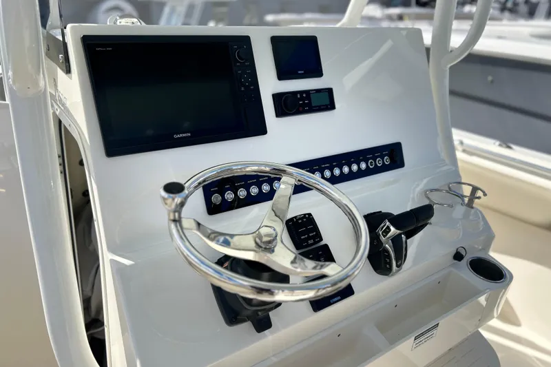Slide: The Image of 2023 Key West 263 FS boat dashboard with Garmin navigation system and steering wheel. - 6