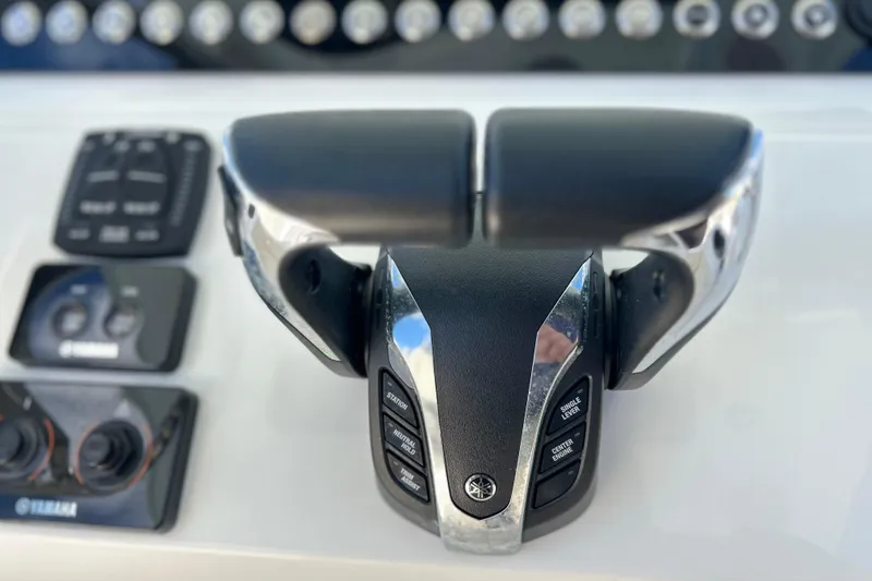 Slide: The Image of 2023 Key West 263 FS boat throttle controls with Yamaha interface. - 9