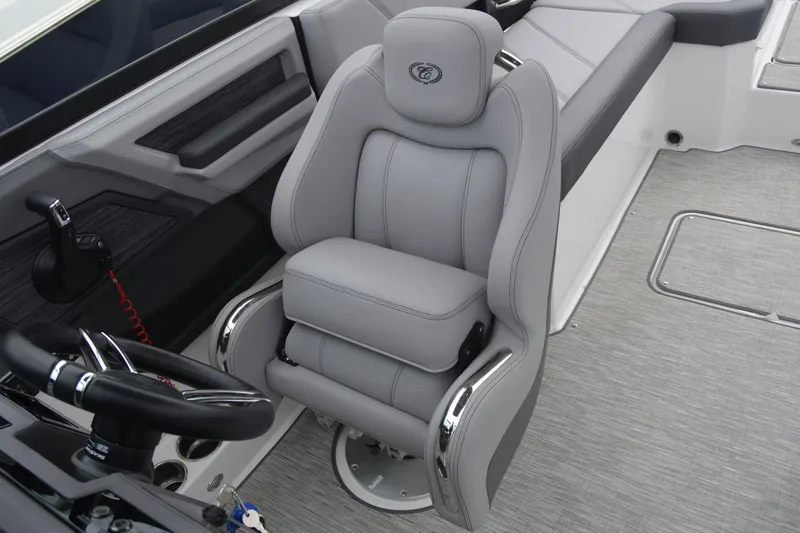 Slide: The Image of 2022 Cobalt R6 Outboard boat interior with luxurious gray captain's seat and steering wheel. - 12