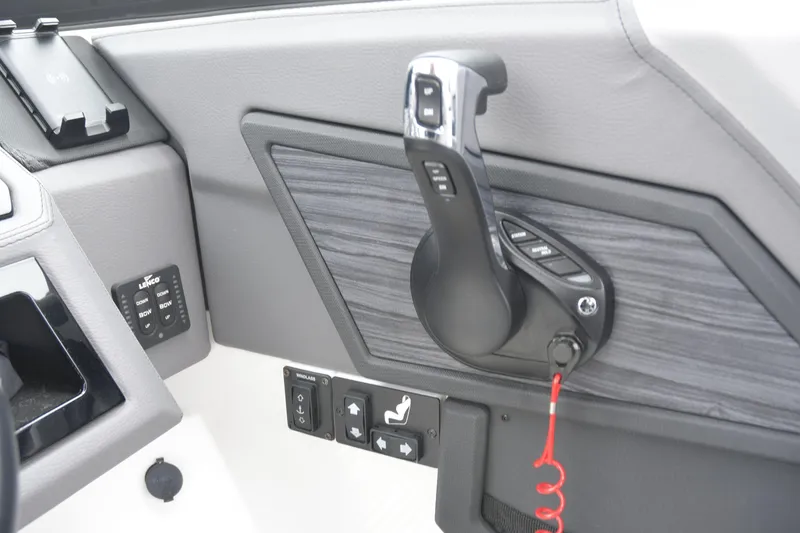 Slide: The Image of 2022 Cobalt R6 Outboard boat control panel with throttle and switches. - 15