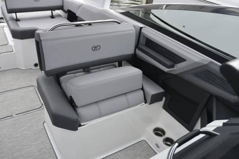 Slide: The Image of 2022 Cobalt R6 Outboard boat interior with gray seating and cup holders. - 16