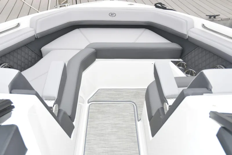 Slide: The Image of Interior seating of 2022 Cobalt R6 Outboard boat, featuring modern gray upholstery. - 19