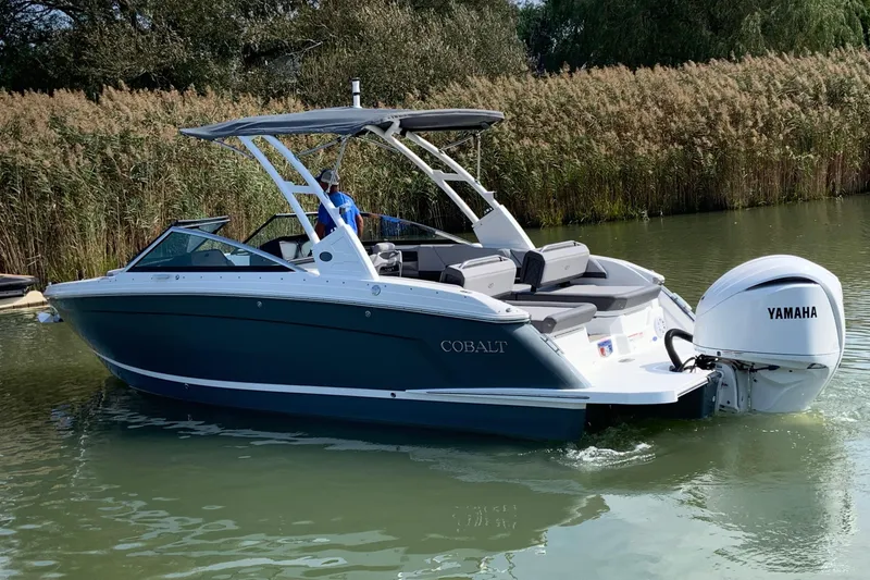 Slide: The Image of 2022 Cobalt R6 Outboard boat with Yamaha engine on a calm waterway. - 2
