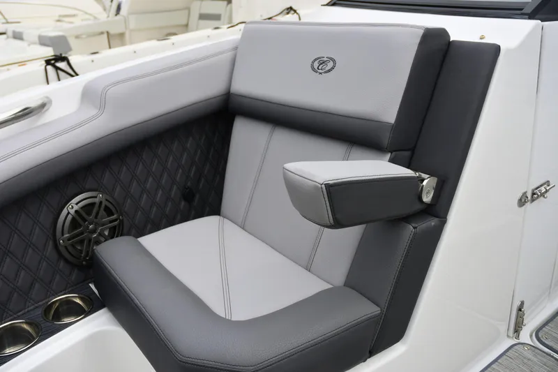 Slide: The Image of 2022 Cobalt R6 Outboard boat seat with armrest and speaker detail. - 20