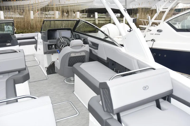 Slide: The Image of 2022 Cobalt R6 Outboard boat interior with modern seating and steering console. - 9