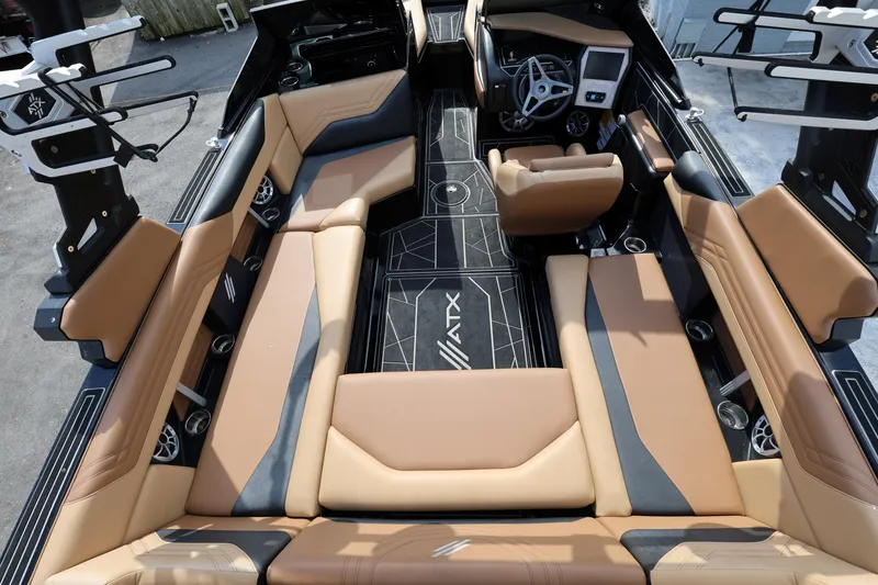 Slide: The Image of 2025 ATX Surf Boats 22 Type-S interior with tan and black seating, modern design. - 16