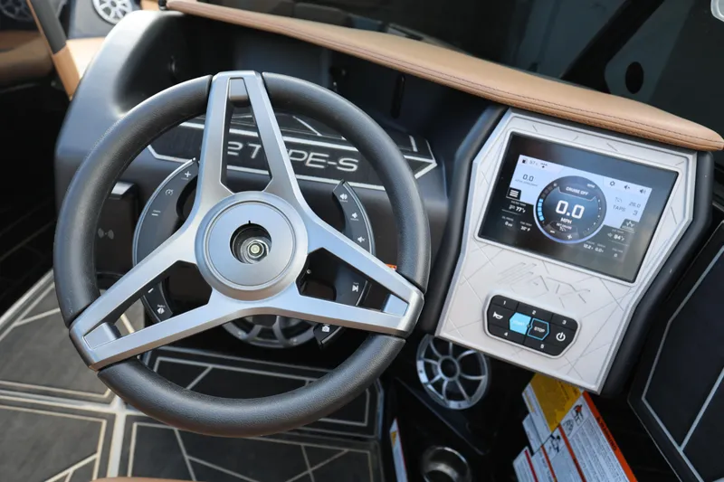 Slide: The Image of 2025 ATX Surf Boats 22 Type-S dashboard with steering wheel and digital display. - 20