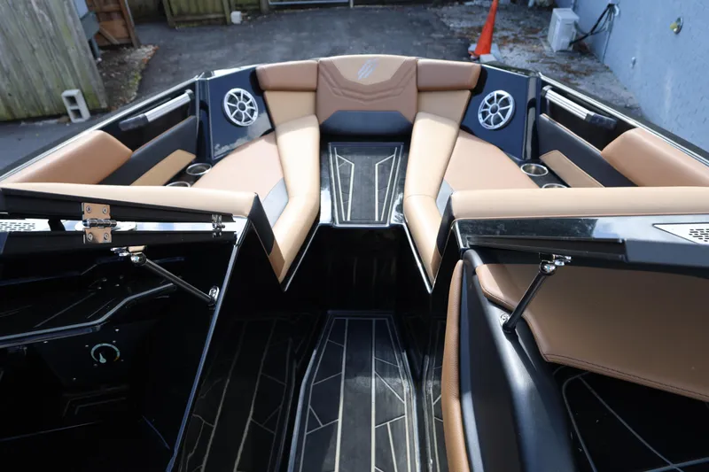 Slide: The Image of 2025 ATX Surf Boats 22 Type-S interior with tan seating and modern design. - 21