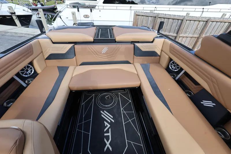 Slide: The Image of 2025 ATX Surf Boats 22 Type-S interior with tan and black seating, stylish design. - 24