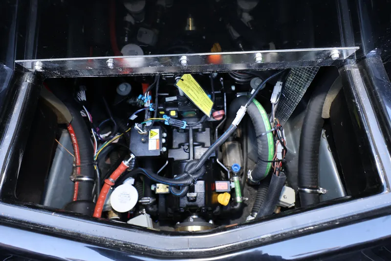 Slide: The Image of Engine compartment of 2025 ATX Surf Boats 22 Type-S, showcasing wiring and components. - 27