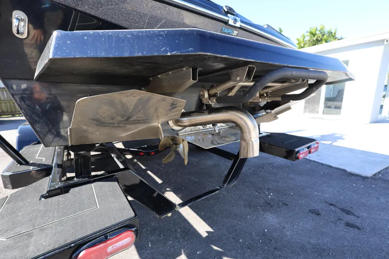 Slide: The Image of 2025 ATX Surf Boats 22 Type-S rear view, showcasing propeller and exhaust system. - 7
