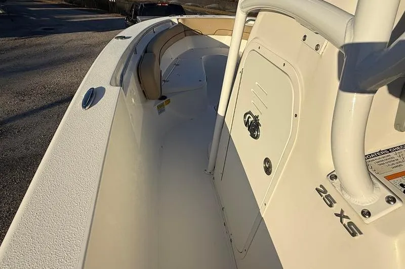 Slide: The Image of 2019 NauticStar 25 XS boat interior with seating and storage compartment. - 19