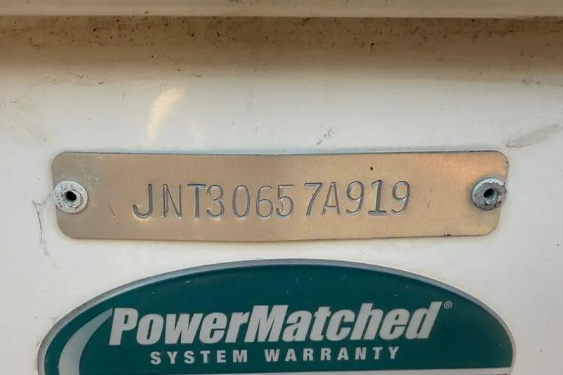 Slide: The Image of 2019 NauticStar 25 XS boat identification plate with PowerMatched system warranty label. - 33