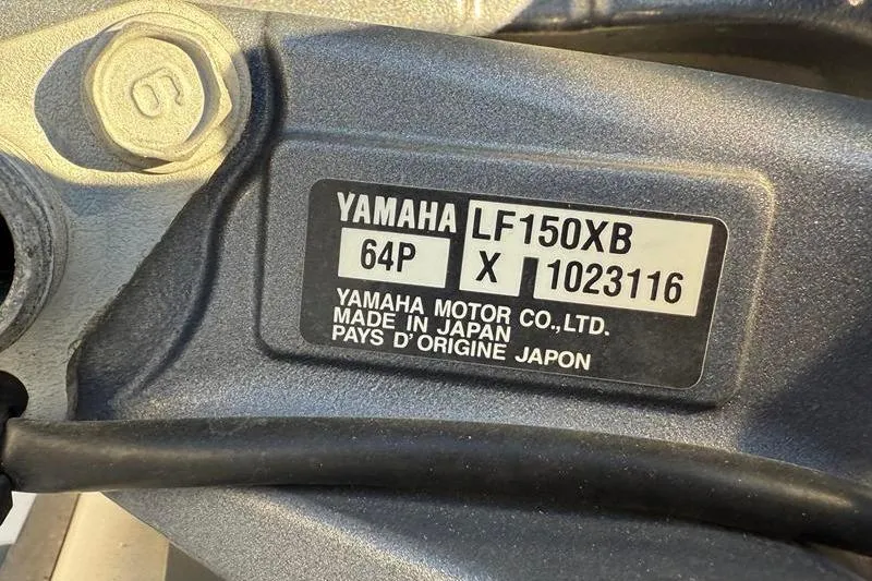 Slide: The Image of Label on Yamaha LF150XB engine, made in Japan, on 2019 NauticStar 25 XS boat. - 35
