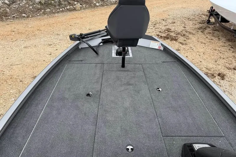 Slide: The Image of 2026 Lowe Stinger 195 Bass boat deck with seating and storage compartments. - 11