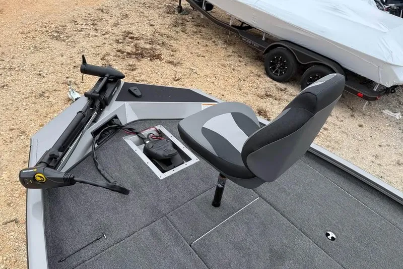 Slide: The Image of 2026 Lowe Stinger 195 Bass boat interior with seat and trolling motor. - 12