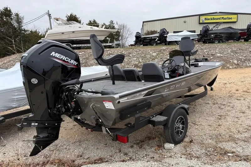 Slide: The Image of 2026 Lowe Stinger 195 Bass boat with Mercury engine at BlackBeard Marine dealership. - 6
