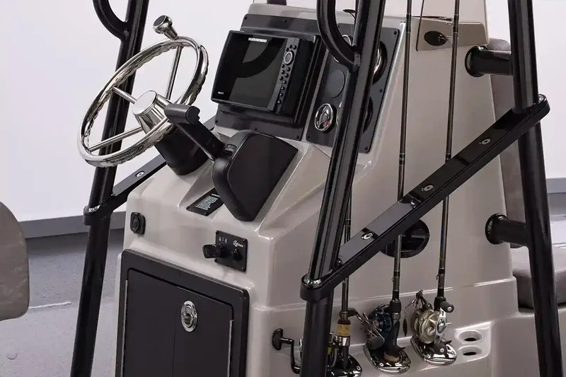 Slide: The Image of Manufacturer Provided Image: 2026 G3 Bay 19 GX boat console with steering wheel, fishing rods, and navigation equipment. - 5