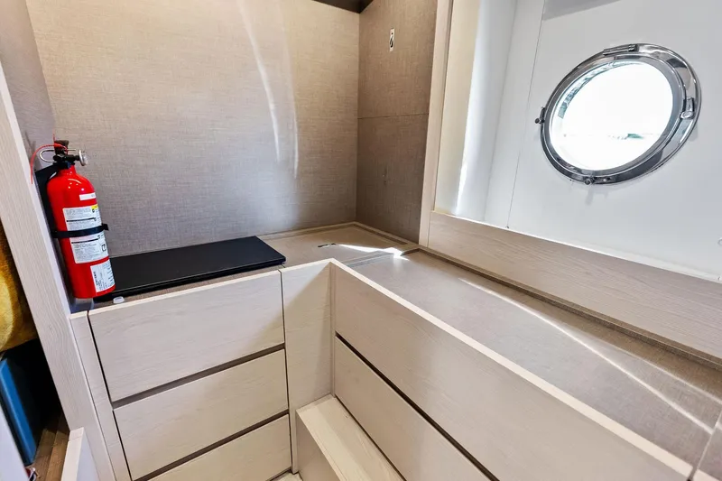 Slide: The Image of Interior of 2021 Azimut Fly 78 yacht with porthole and fire extinguisher. - 107