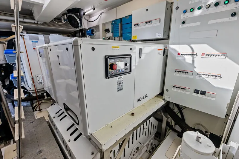 Slide: The Image of Engine room of 2021 Azimut Fly 78 yacht with Kohler generator and control panels. - 119