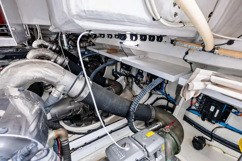 Slide: The Image of Engine room of 2021 Azimut Fly 78 yacht, showcasing complex machinery and piping. - 121
