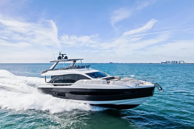 Slide: The Image of 2021 Azimut Fly 78 yacht cruising on open sea under clear blue sky. - 20