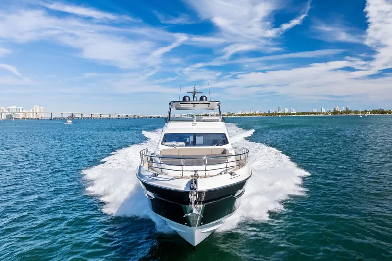 Slide: The Image of Azimut Fly 78 yacht cruising on blue waters under a clear sky, 2021 model. - 25