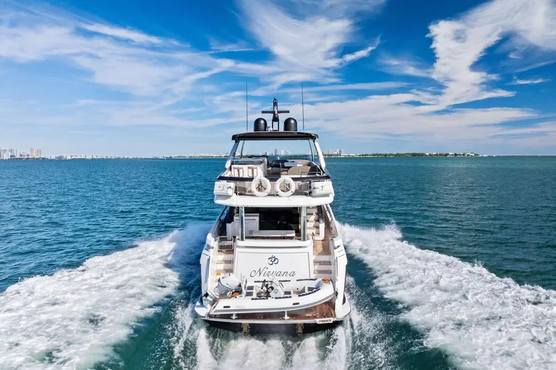 Slide: The Image of 2021 Azimut Fly 78 yacht cruising on open water under a clear blue sky. - 27