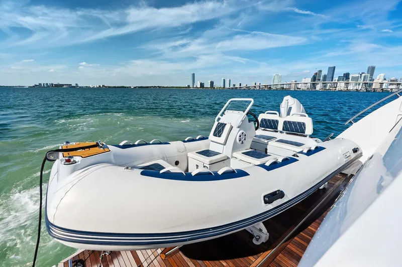 Slide: The Image of Luxury Azimut Fly 78 yacht with inflatable boat, city skyline in background, 2021 model. - 34
